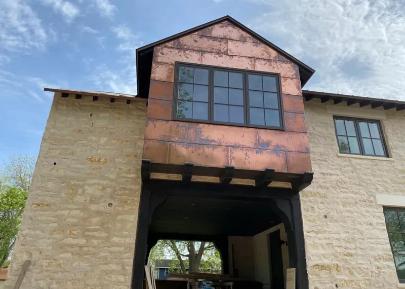 Copper metal panel facade on a stone building for Metal Roof Coating in Highland Park